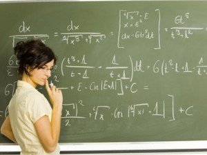 Solving math problems at the chalkboard